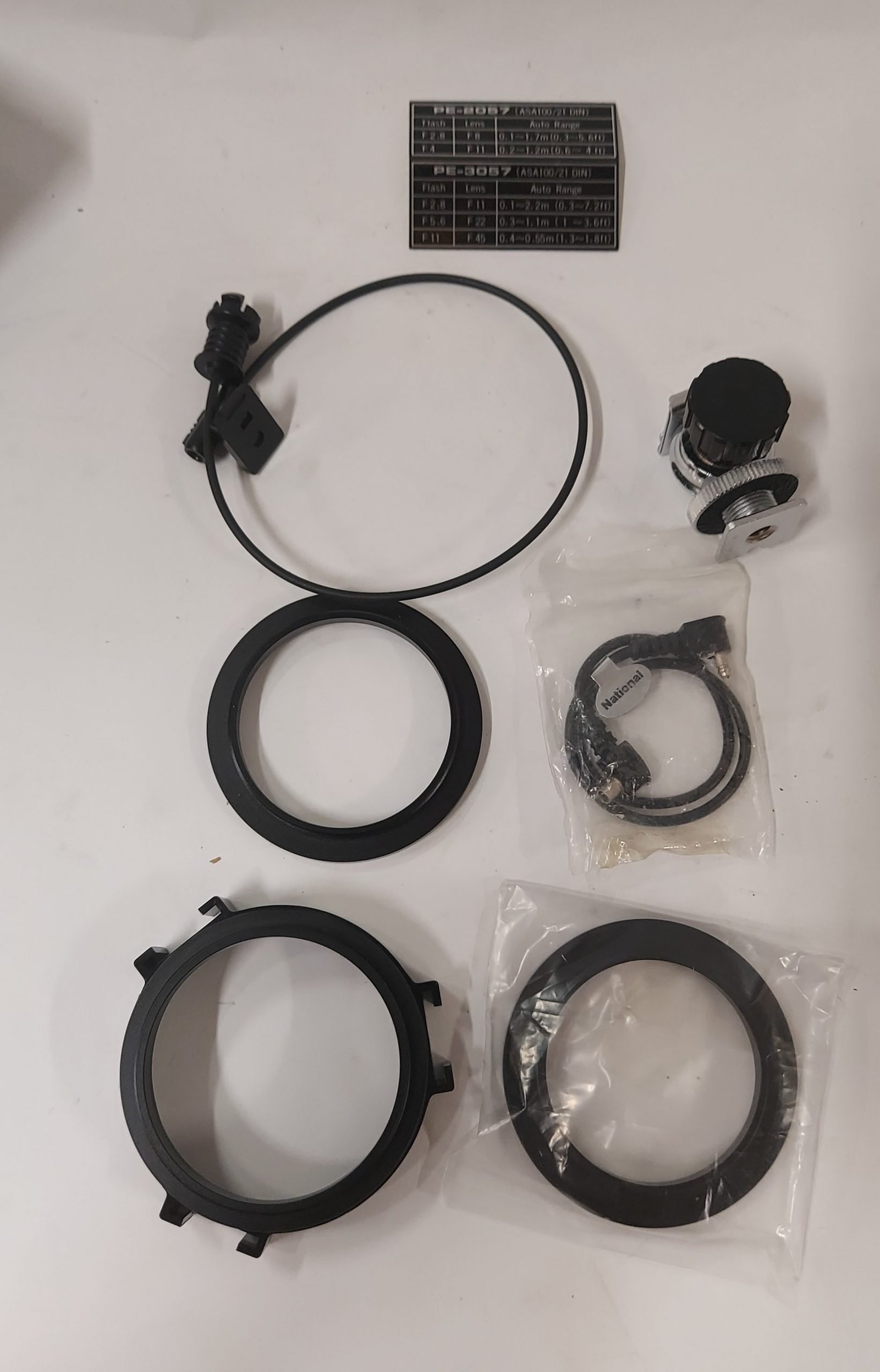 Accessori per obiettivi fotografici con custodia National